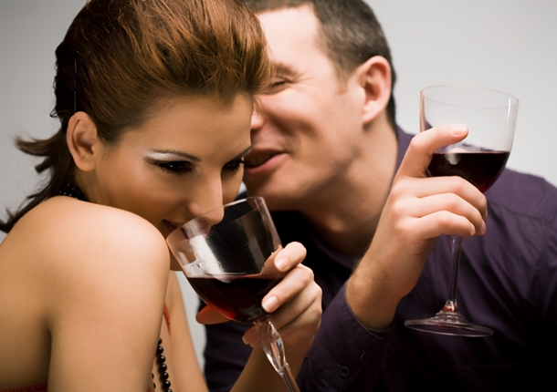 Couple Flirting and Drinking Wine