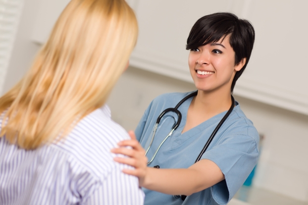 Woman Being Reassured by Doctor